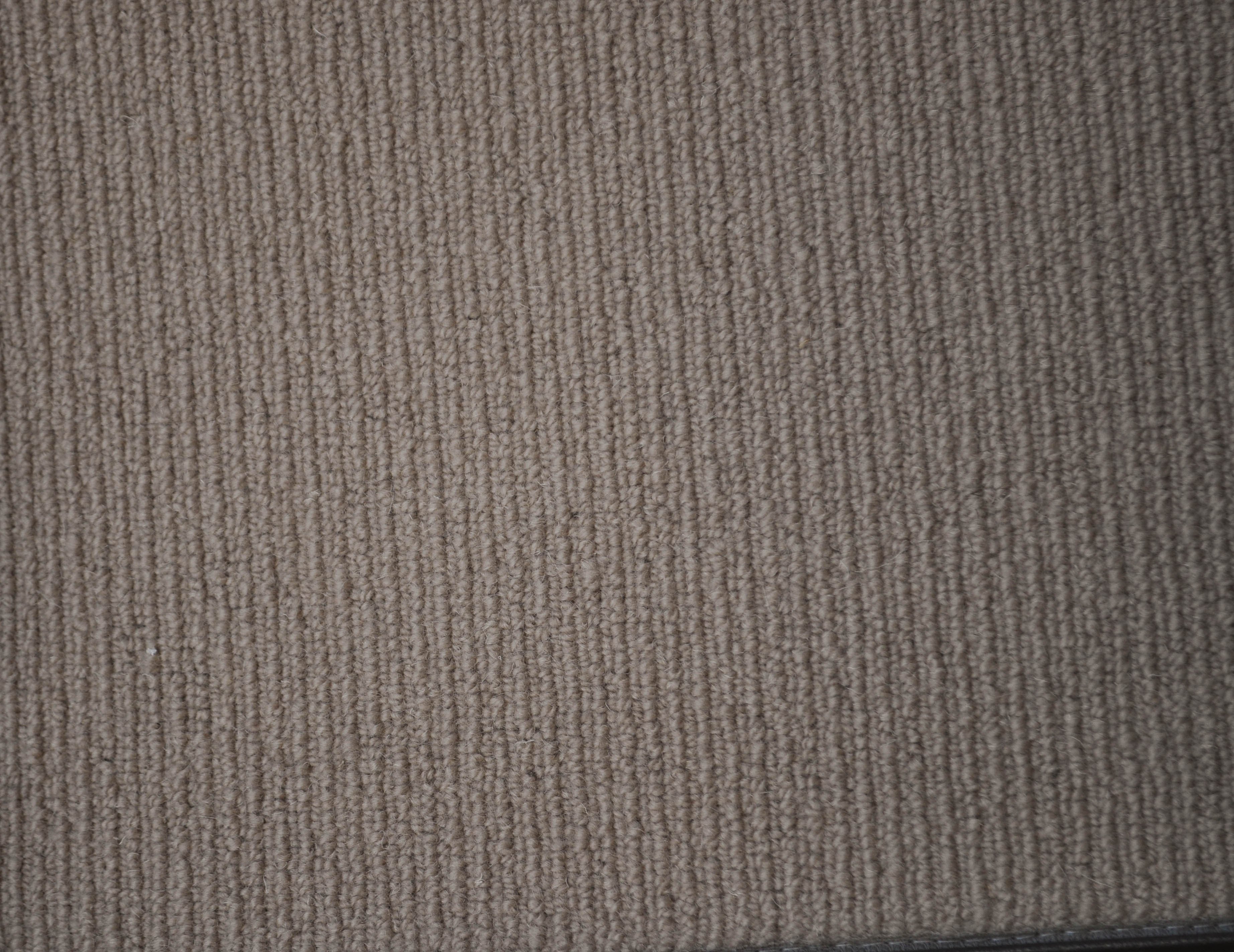 showing a sample of carpet, it being of an brown color, sisal tram trek yarn carpet on sale at Concord Floors.