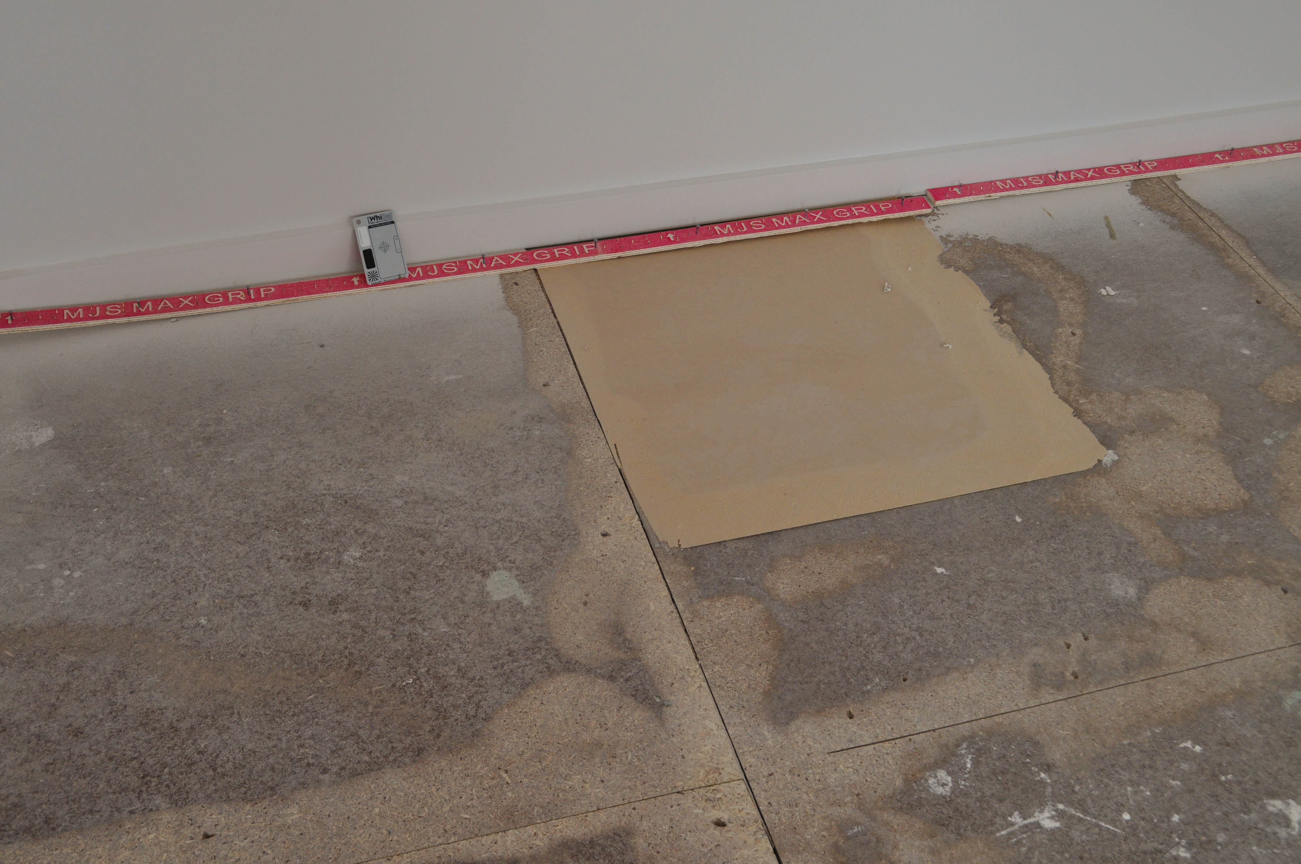 a floor in a room, in a house in Point Cook, Werribee where the particle boards are at different heights and
 where the timber floor boards have been sanded down with an edge sander by Concord Floors.
