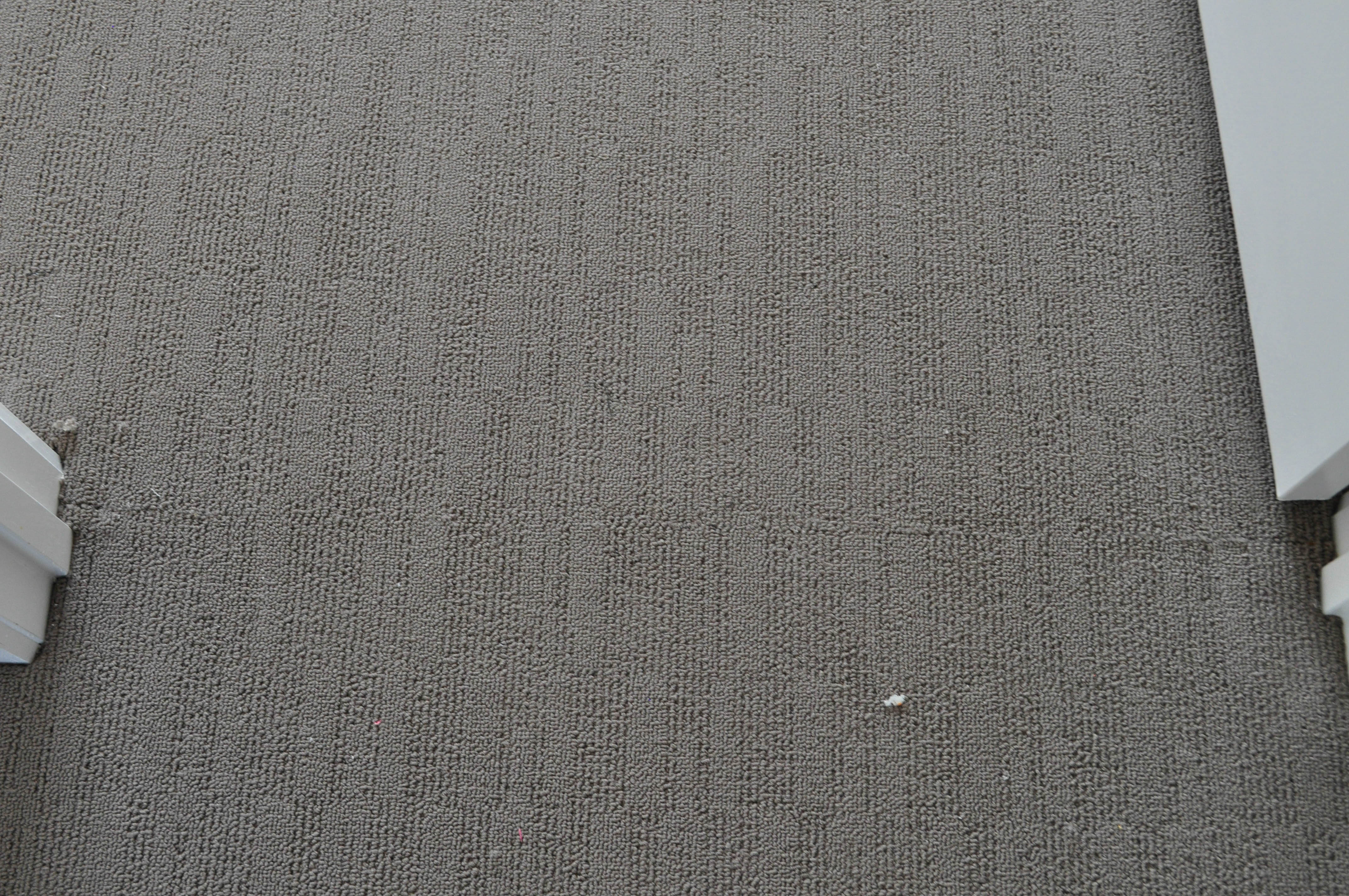 2 bodies of carpet have been joined in the doorway between the two rooms and the carpet has been pattern-matched lengthwise and sidewise.