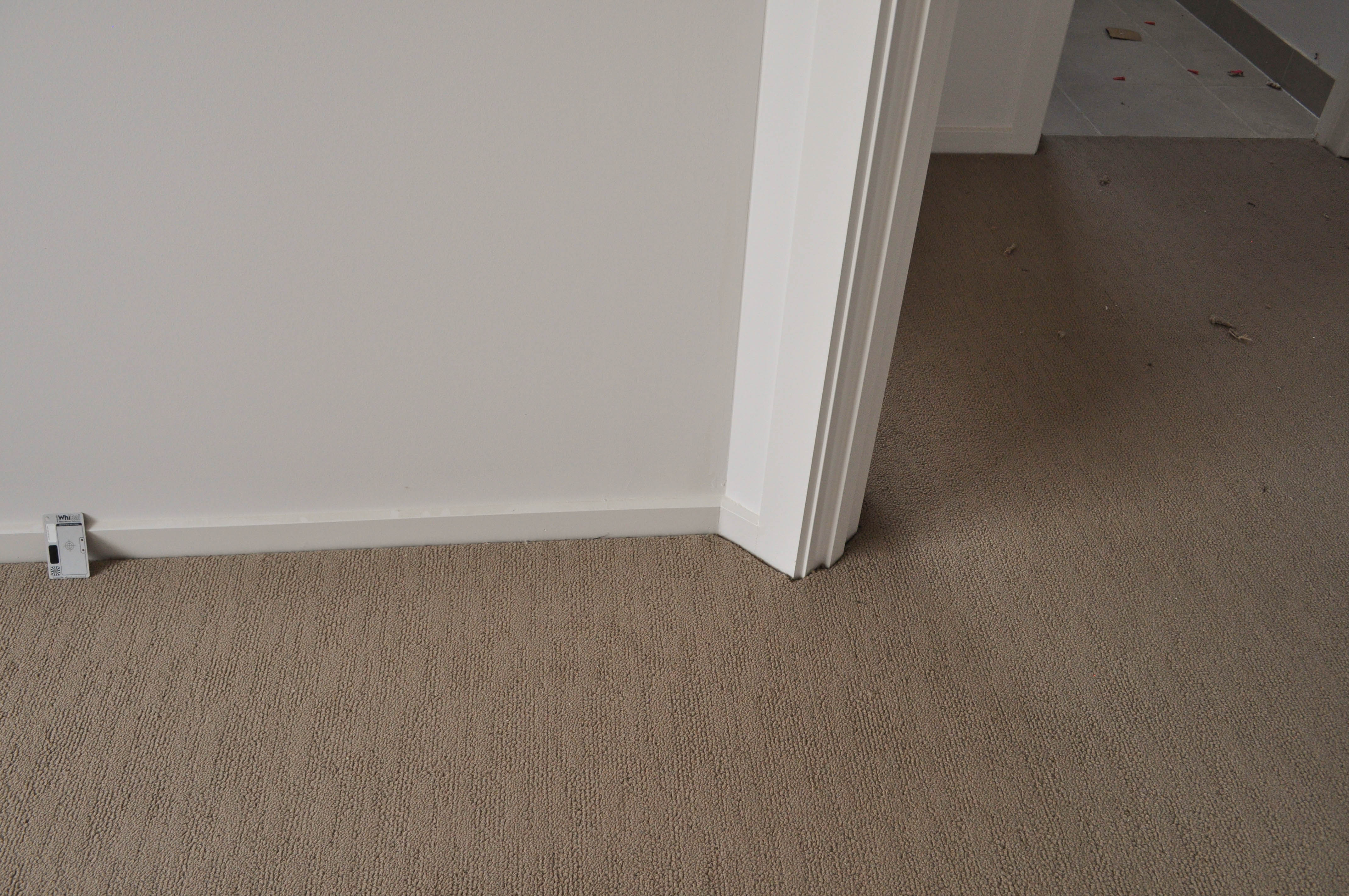 showing a bedroom with carpet covering the bedroom floor, which is of a polypropelene loop-pile yarn, of a beige color and has a wear rating of heavy duty including stairs. 
	  It was supplied and installed by the carpet store Concord floors.