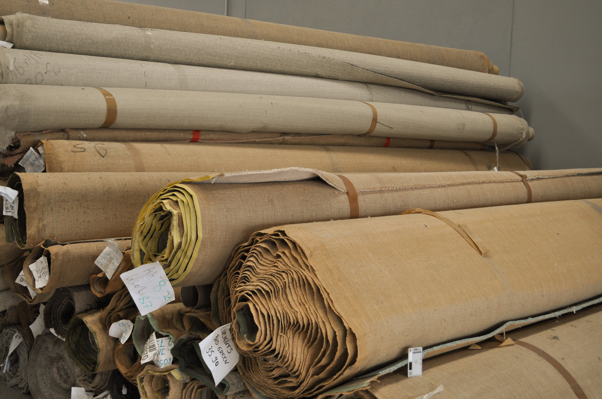 many various sized rolls of carpet in the warehouse of Concord Floors in Derrimut Vic 3026. The rolls constitute the carpet stock of 
	  Concord Floors which is carpet for sale to the public