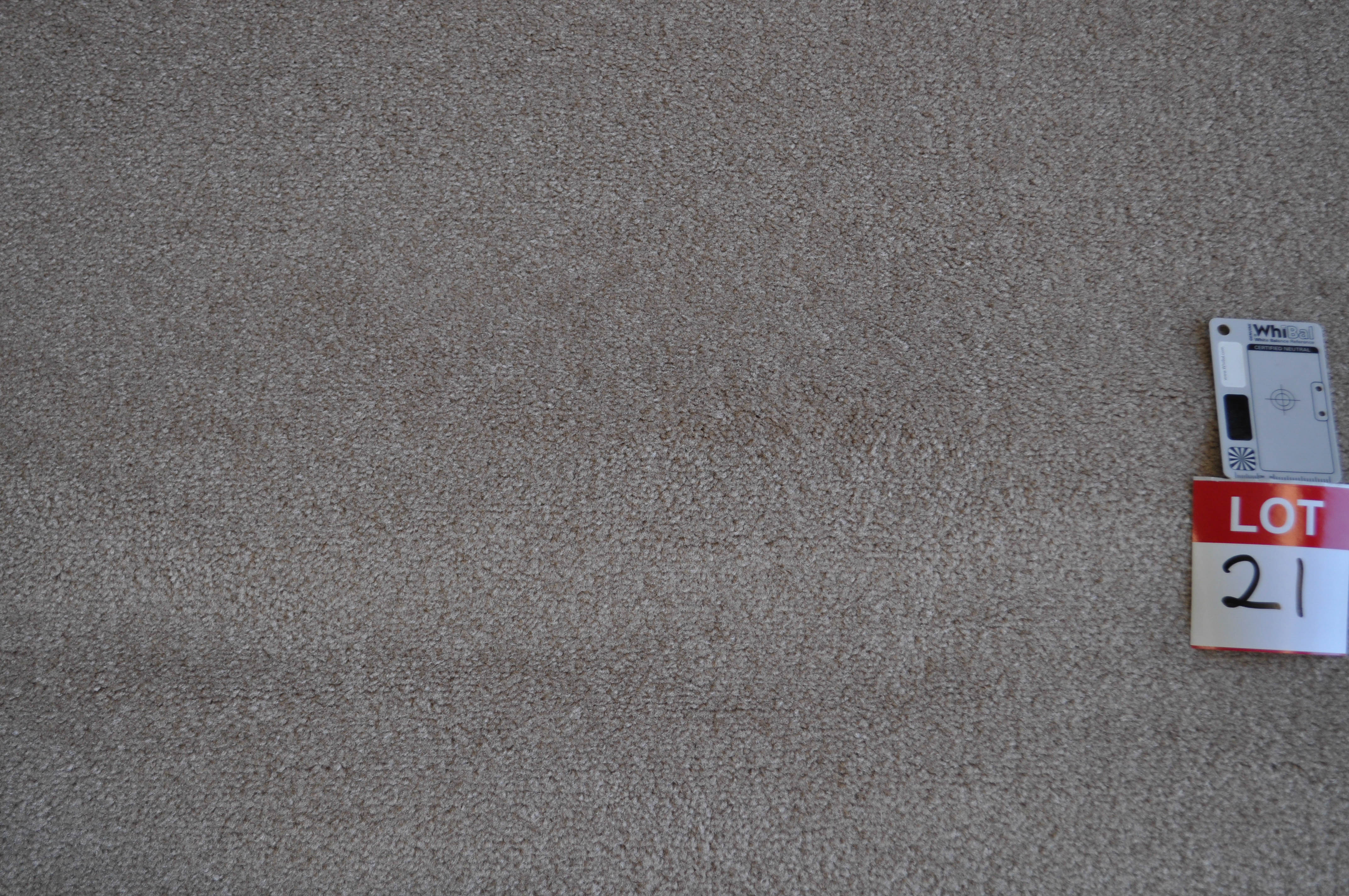 a sample of a dyed nylon carpet, beigie/gold color in a roll in the warehouse of Concord Floors and supplied to the public
 by Concord Floors.