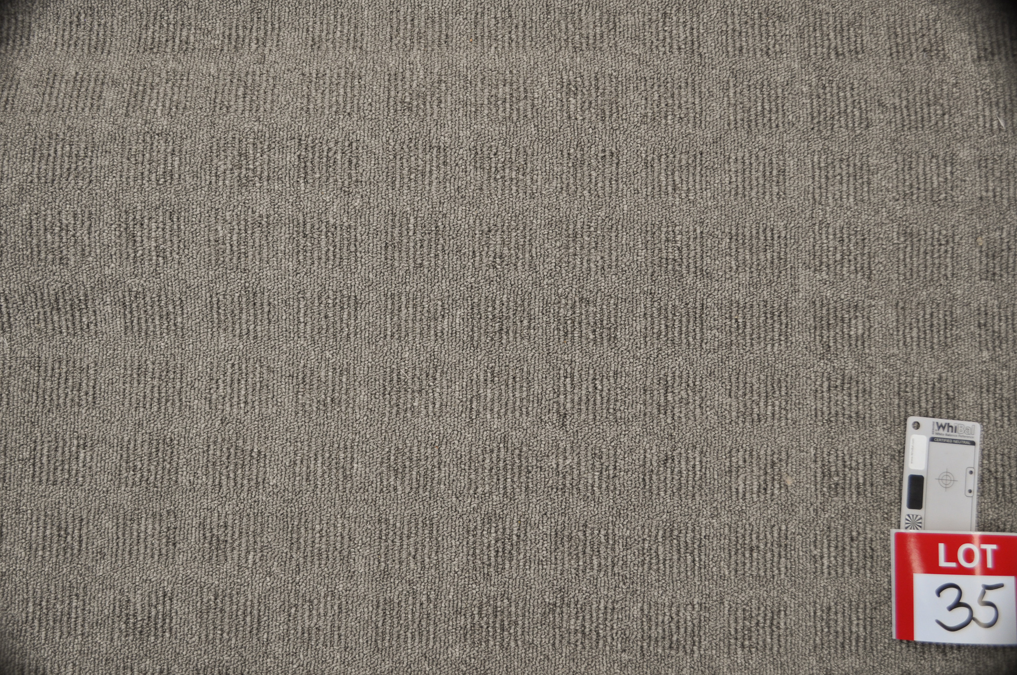 grey colored, modulated loop pile roll of carpet on sale at Concord Floors, it being a remnant roll in Concord Floor's warehouse.