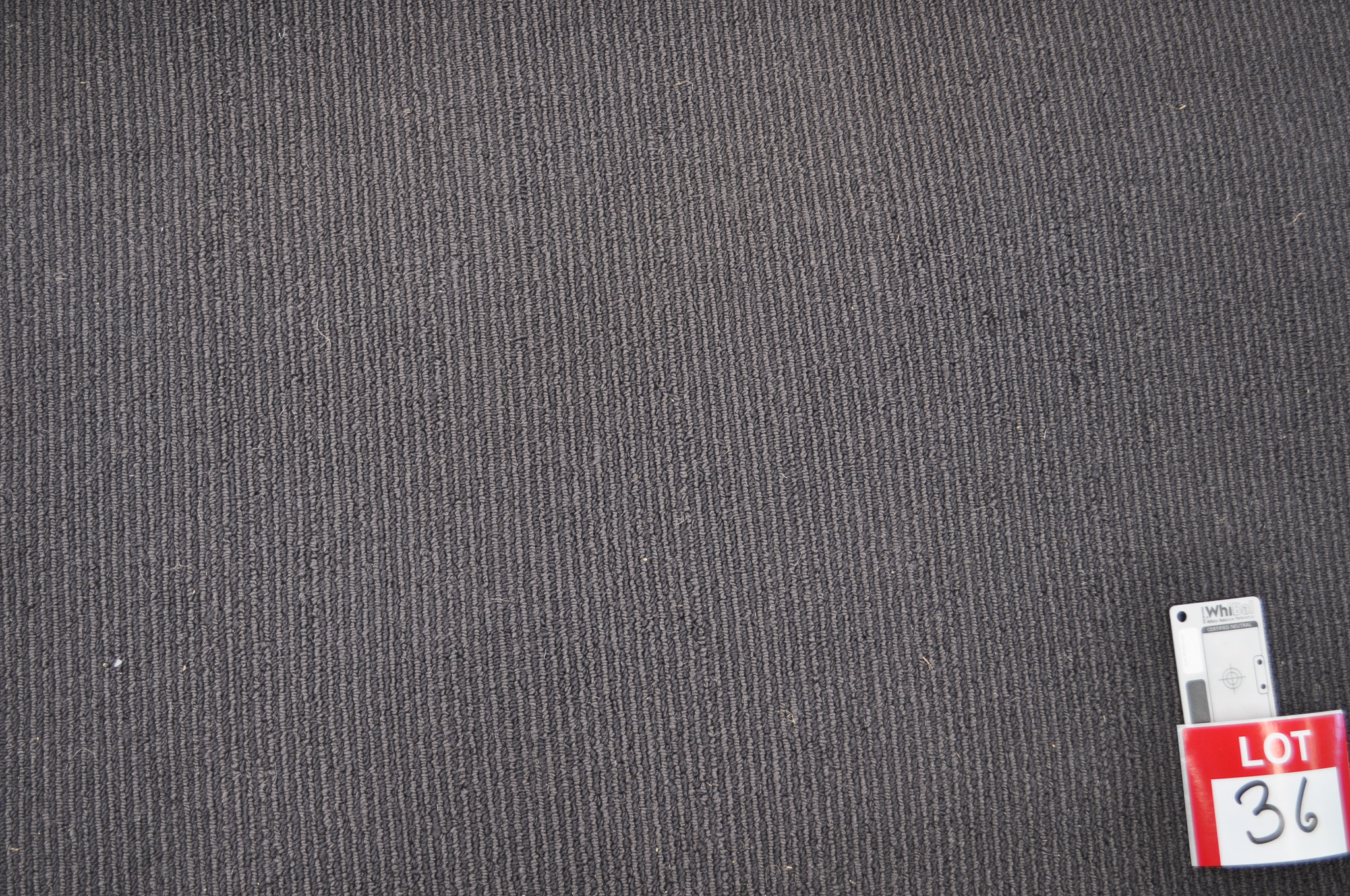 dark grey colored, sisal pile roll of carpet on sale at Concord Floors, it being a remnant roll in Concord Floor's warehouse.