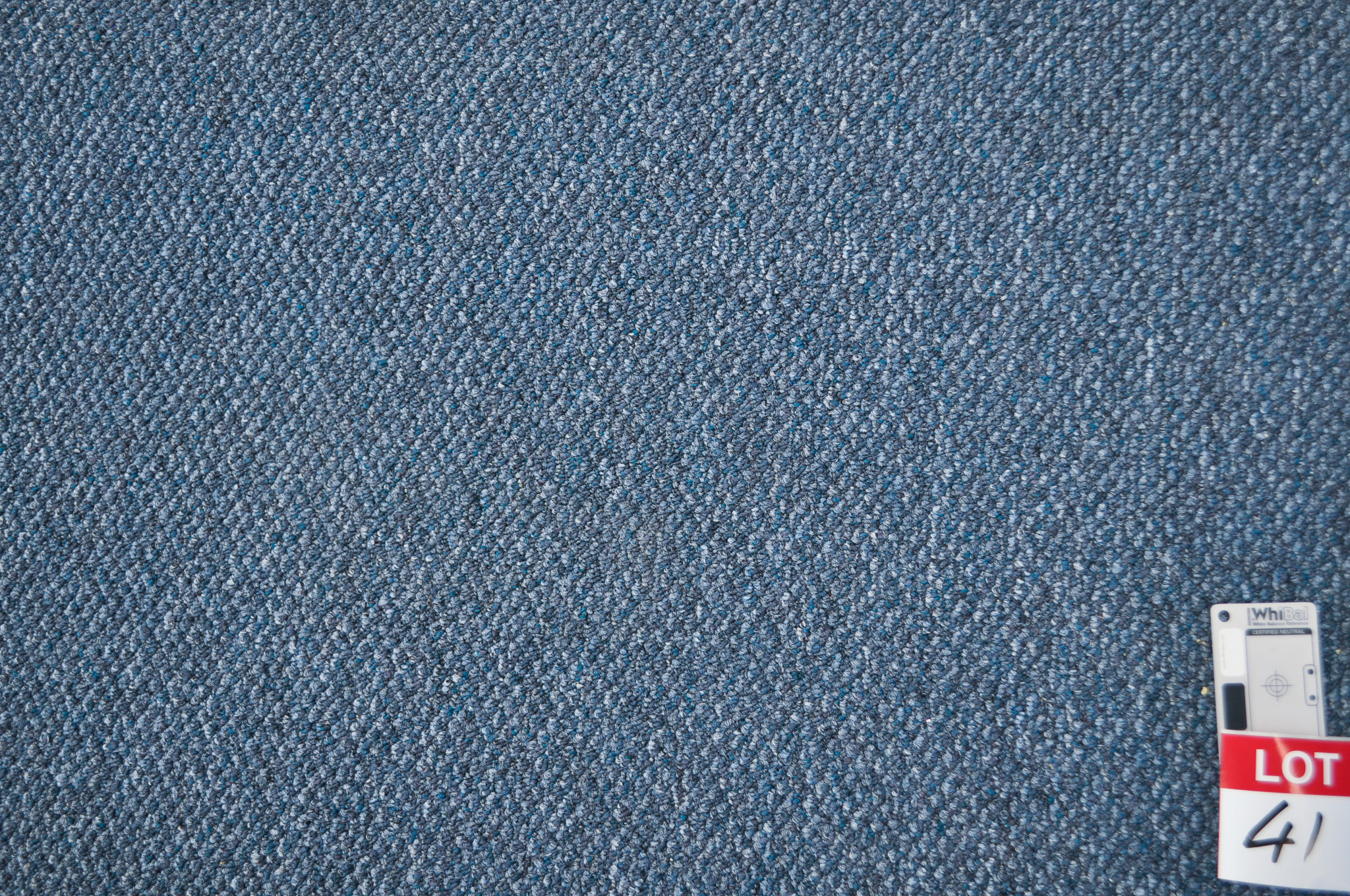 blue colored, modulated pile roll of carpet on sale at Concord Floors, it being a remnant roll in Concord Floor's warehouse.