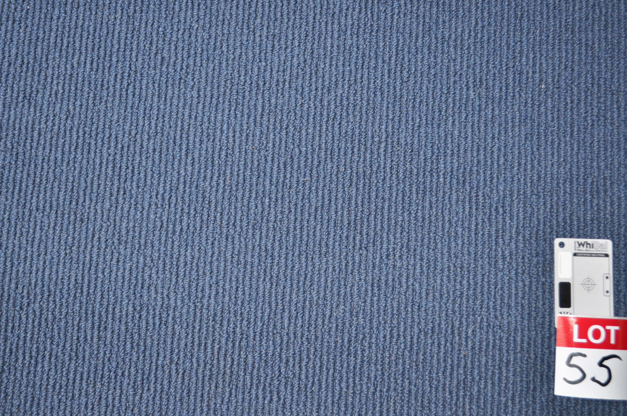 blue colored, sisal pile roll of carpet on sale at Concord Floors, it being a remnant roll in Concord Floor's warehouse.