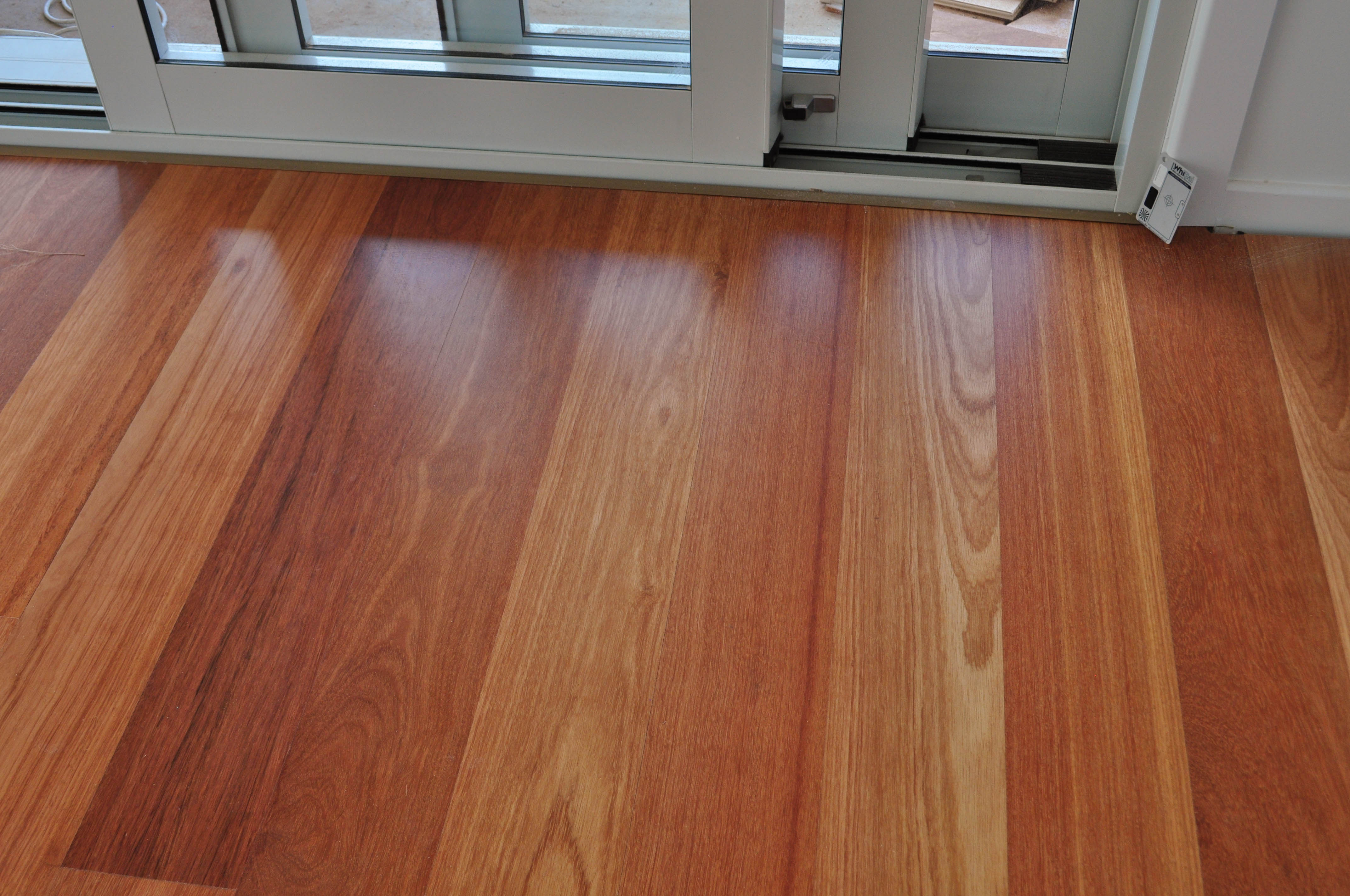 showing a living room where engineered flooring, species kempes, has been installed in a house.
