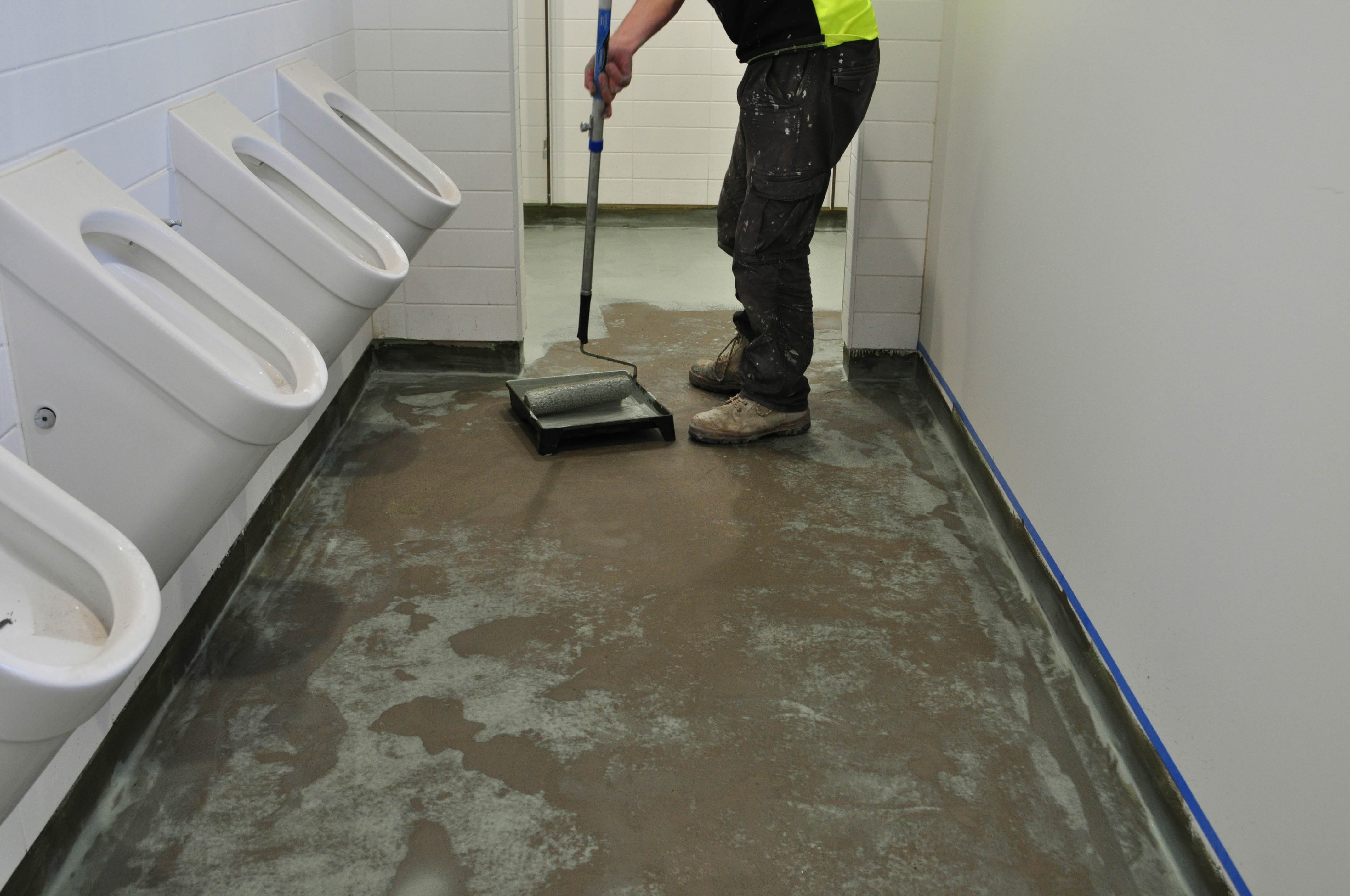 showing a toilet floor in a church that has had floor leveller applied to it.