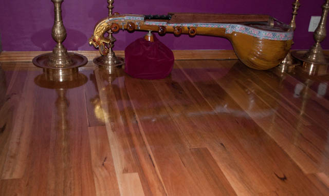 showing a room with a newly laid spotted gum solid timber floor in a house in the suburb of Taylors Lakes. The floor is an orangey color