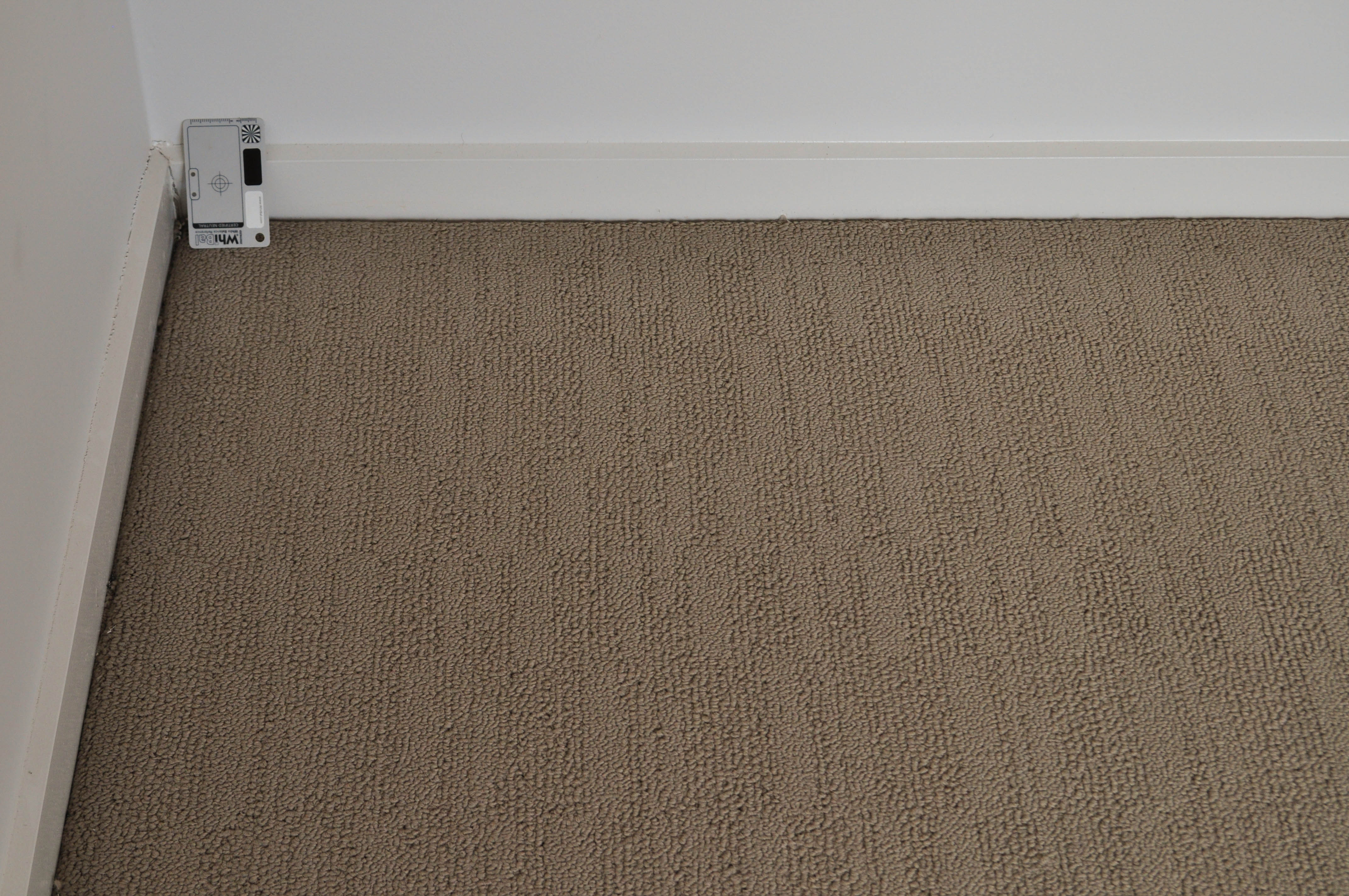 showing a room with a cream patterned carpet on th floor in  home where carpet is installed.