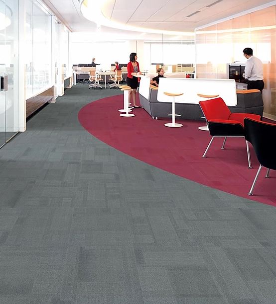 patterned, gray carpet tiles with red carpet tiles on the floor of the PENTLAND range called on sale at Concord Floors installed in a room.