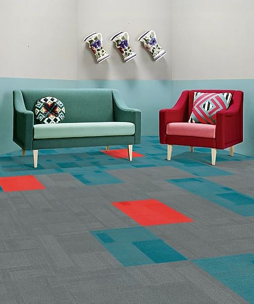 patterned, colorful carpet tiles in the color blue, red and grey of the PENTLAND range installed in an office on sale at Concord Floors.