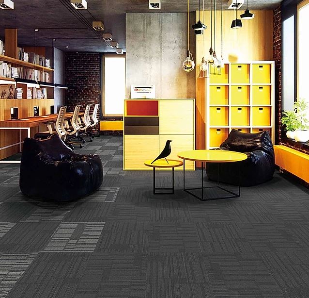 patterned,  colored, carpet tile of the  range called SIESTA on sale at Concord Floors installed in a room.