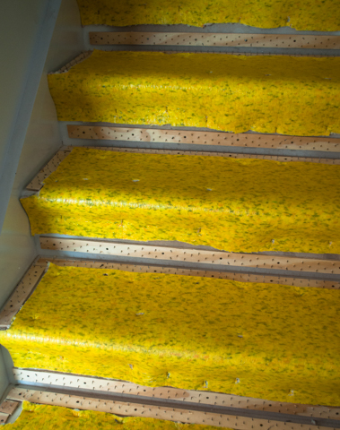 finished carpet laying of gripper and underlay in laying of a staircase.