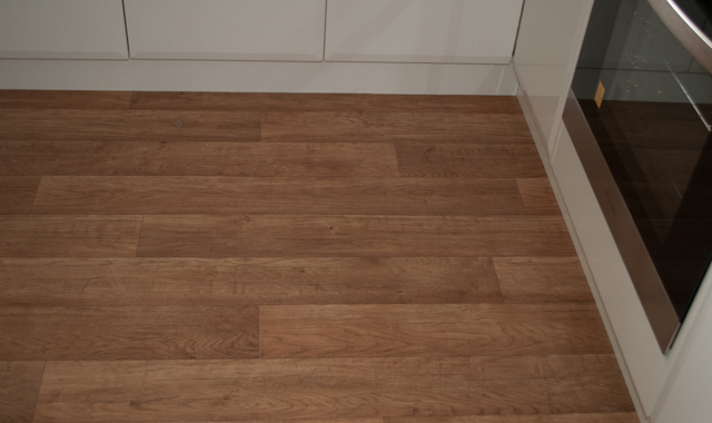 dommestic vinyl with a timber look pattern on its surface, installed in a kitchen, by Concord Floors, in a home in
         Melton, Vic 3337.