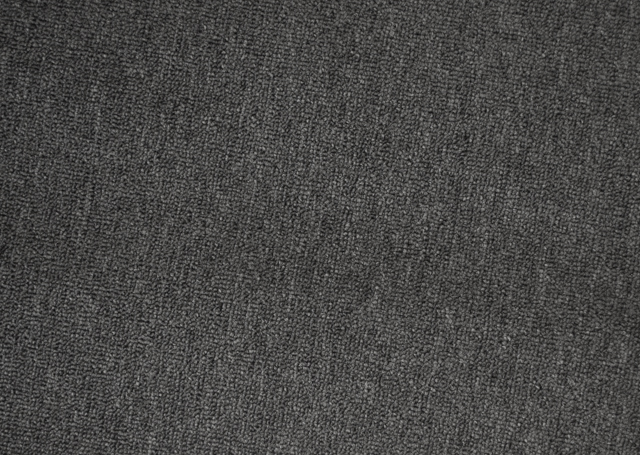 a sample of charcoal colored, level loop pile carpet.