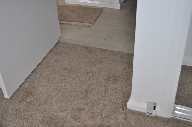 an inexpensive polyester twist pile carpet, brown color expertly installed in a home in Werribee by Concord Floors
 and supplied to the public by Concord Floors.