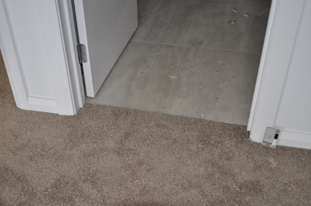 a sample of beige colored, nylon, twist-pile carpet.