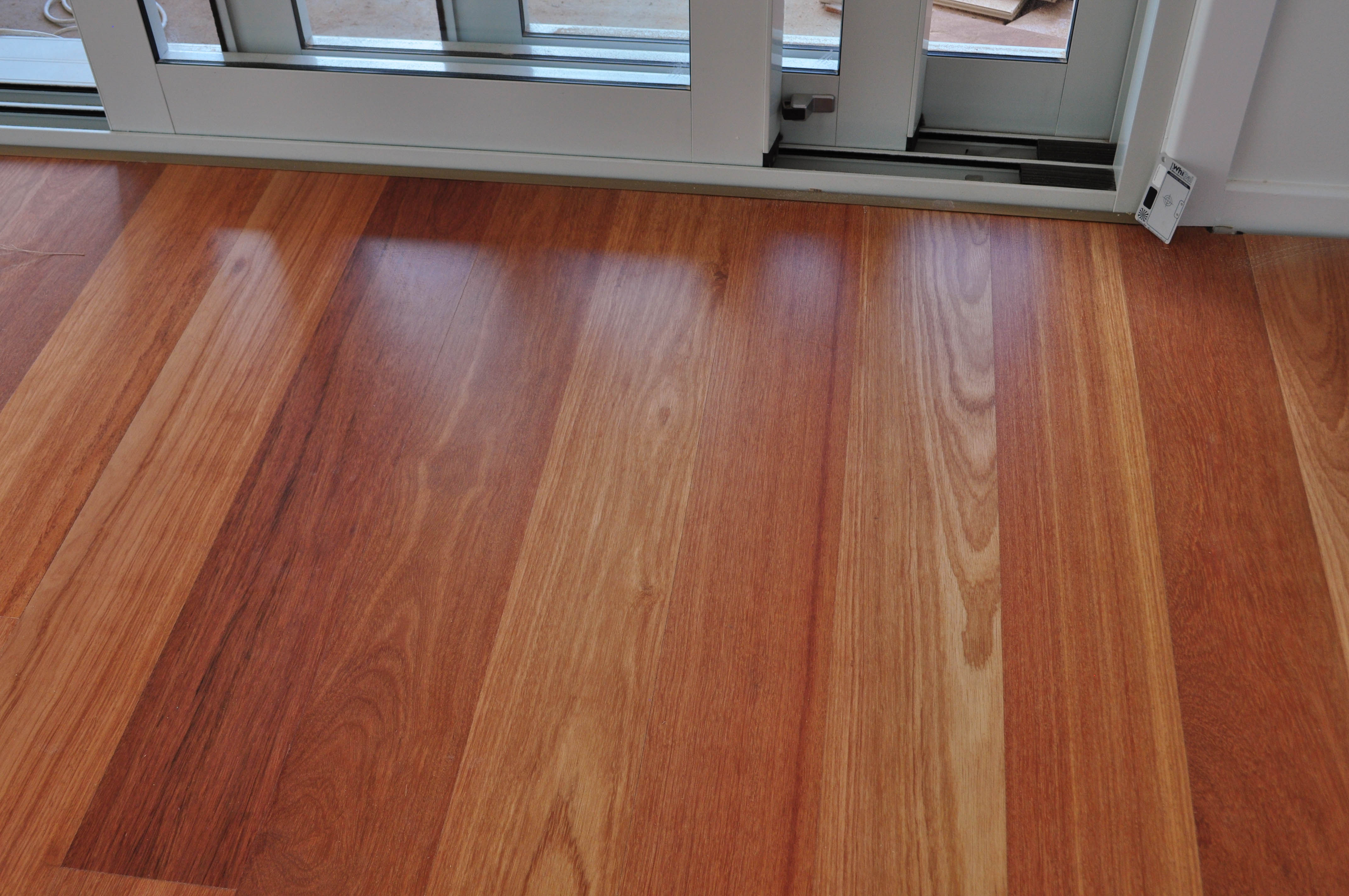 showing a dining room with the floor being floorboarded with the timber species -kempes.