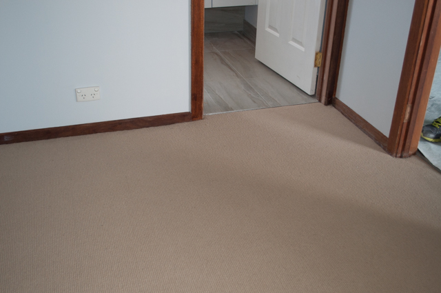 cream colored sisal wool fibre carpet installed in a room by Concord floors.
