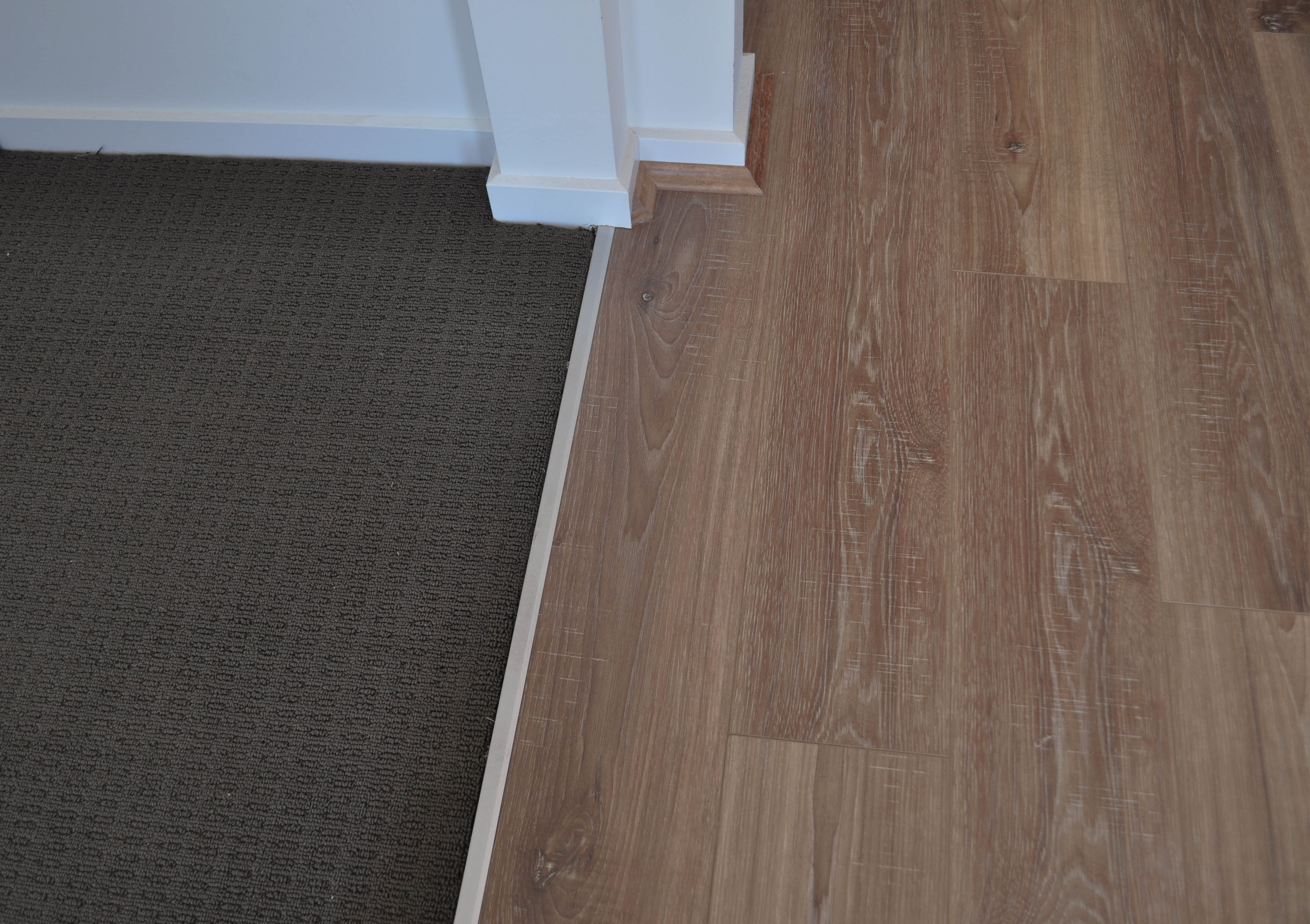 showing the elegant interior decor created by the 12mm thick aged oak laminate flooring installed in a room supplied and 
  installed by Concord Floors.The room is in a house in the suburb of tarneit, hoppers Crossing Vic 3340. The picture shows Laminate floorboards lock into each other at their perimiter boundaries
 with an engineered locking system to form one continuous floor. They simply click together and when in place they stay together.