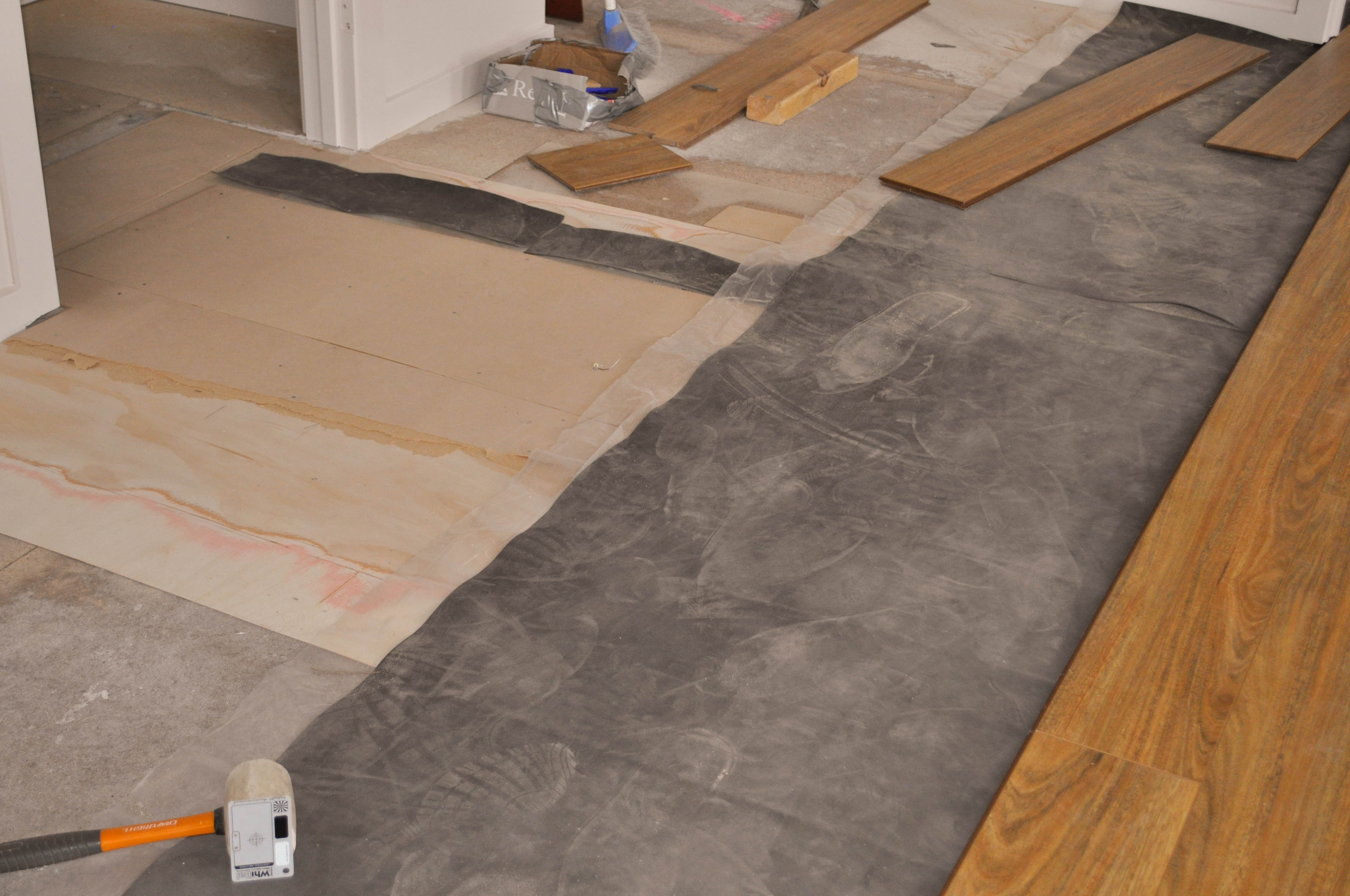 a room where the sub-floor has been leveled by placing a 3mm thick plywood sheet to fill the low spot in the floor.
 The floor was then sanded and some spotted gum floorboards were laid over the plywood filling and the sanded floor. The levelled floor was still uneven so it has 2mm thick, black 
 underlay placed on top of the plywood to add to the thickness of the filling material which is filling the low spot of the sub-floor. This finally levelled the floor and the laminate
 floorboards were the commenced to be laid.This work of leveling the floor was done by Concord Floors in the suburb of Point Cook, Werribee Vic 3030. This is information
   as to how to install laminate flooring for the do it yourself floor board laminate flooring installer.