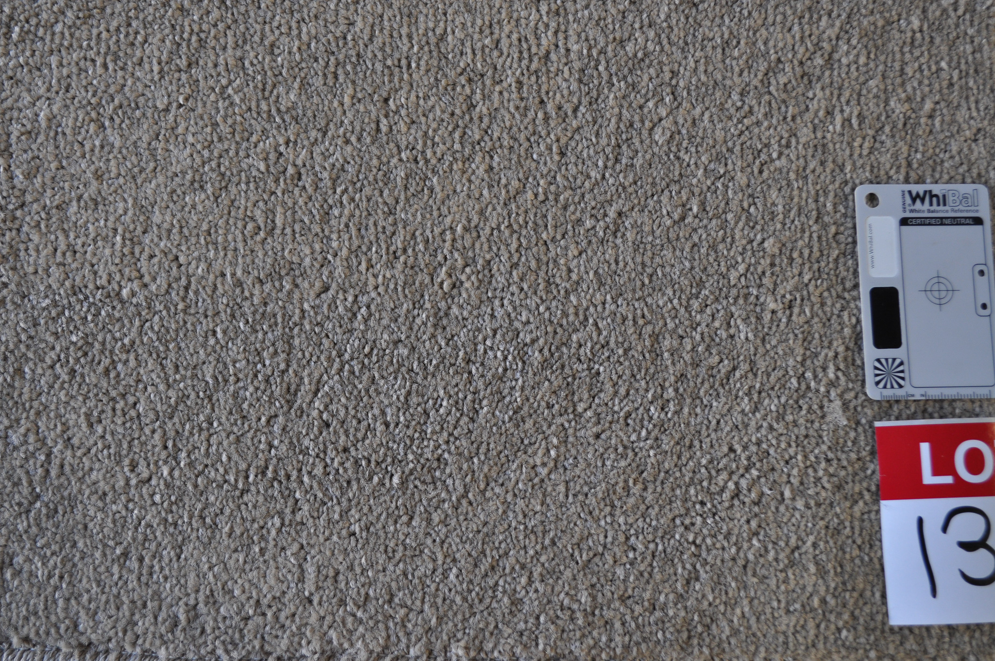grey colored, twist pile roll of carpet on sale at Concord Floors, it being a remnant roll in Concord Floor's warehouse.