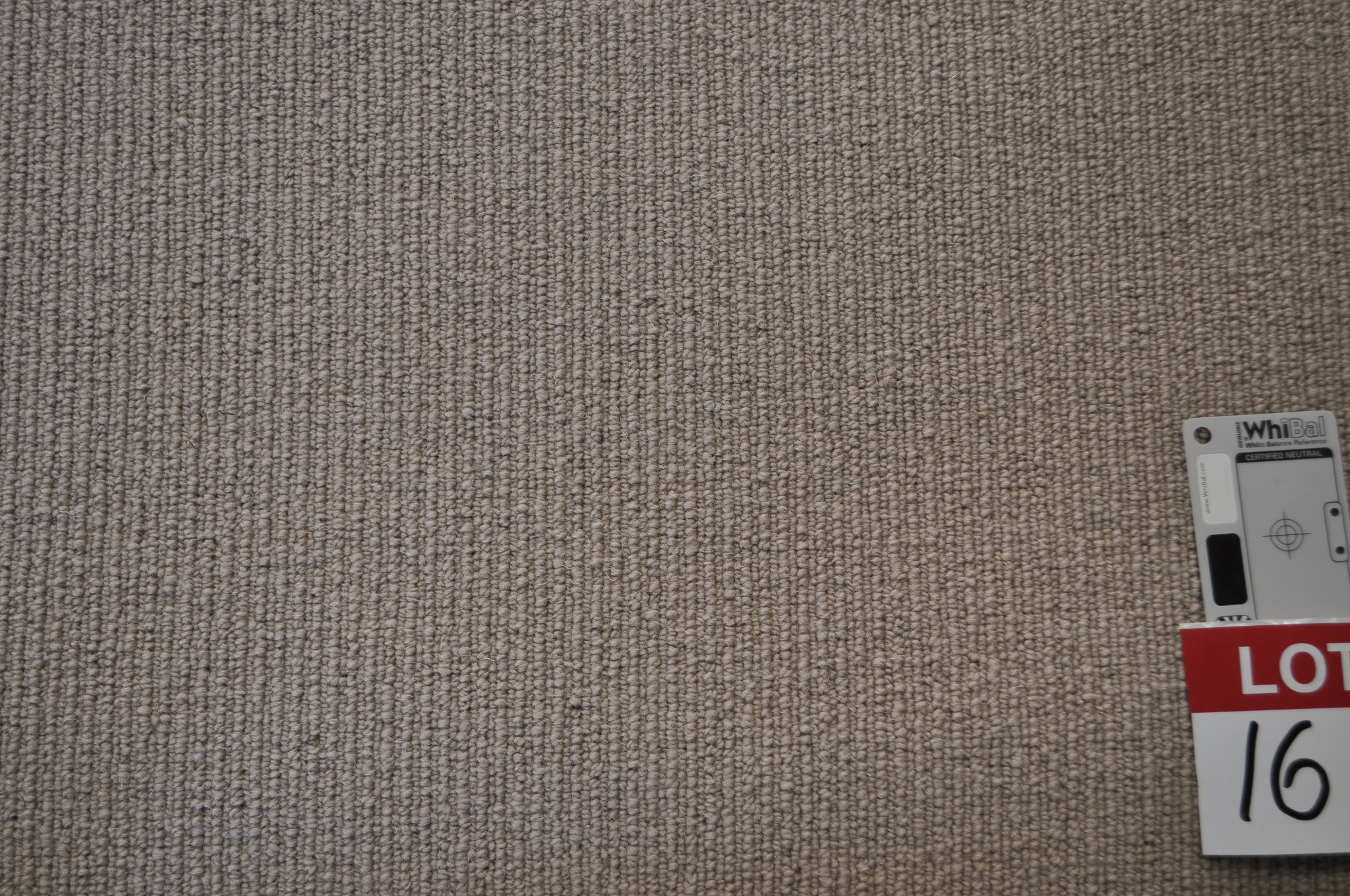 dark beige colored, sisal type, roll of carpet on sale at Concord Floors, it being a remnant roll in Concord Floor's warehouse.