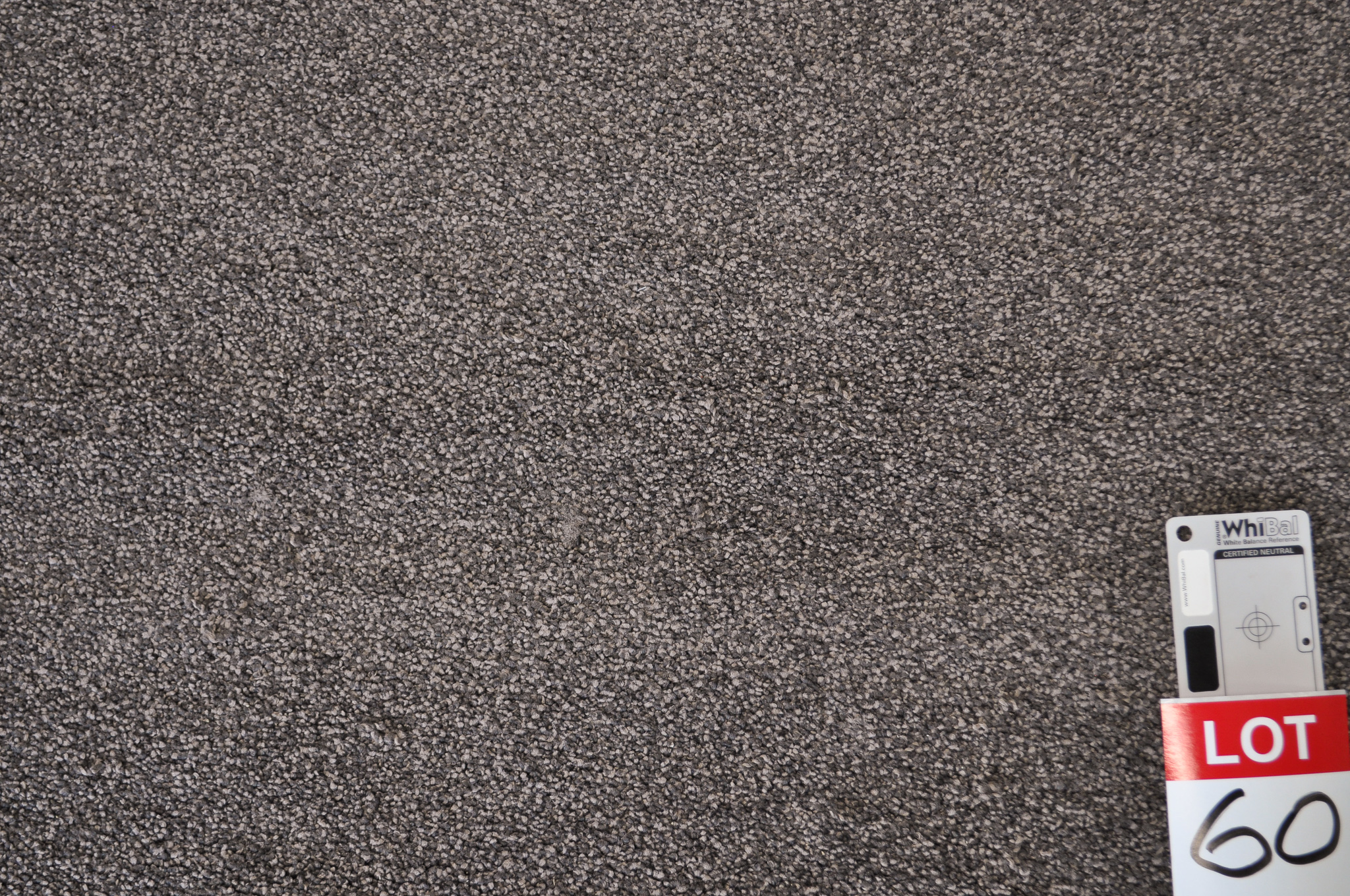 dark grey colored, nylon twist pile roll of carpet on sale at Concord Floors, it being a remnant roll in Concord Floor's warehouse.