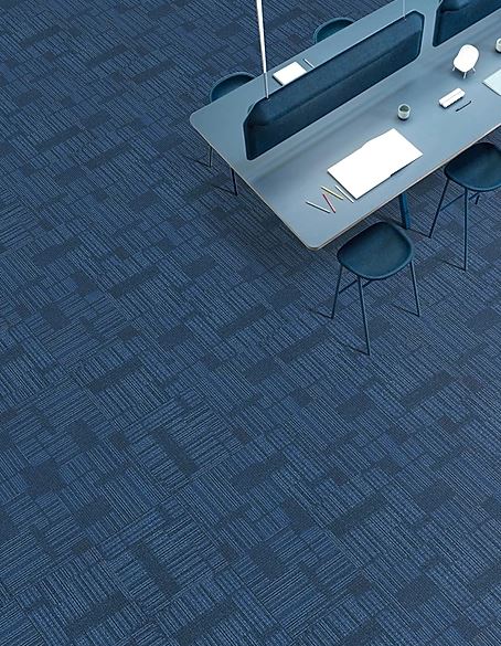 patterned, blue striped carpet tile of the COMMONWEALTH range called Toorak on sale at Concord Floors installed in a room.