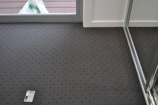 a room carpeted by Concord Floors, with charcoal colored, patterned carpet in a house in Altona.